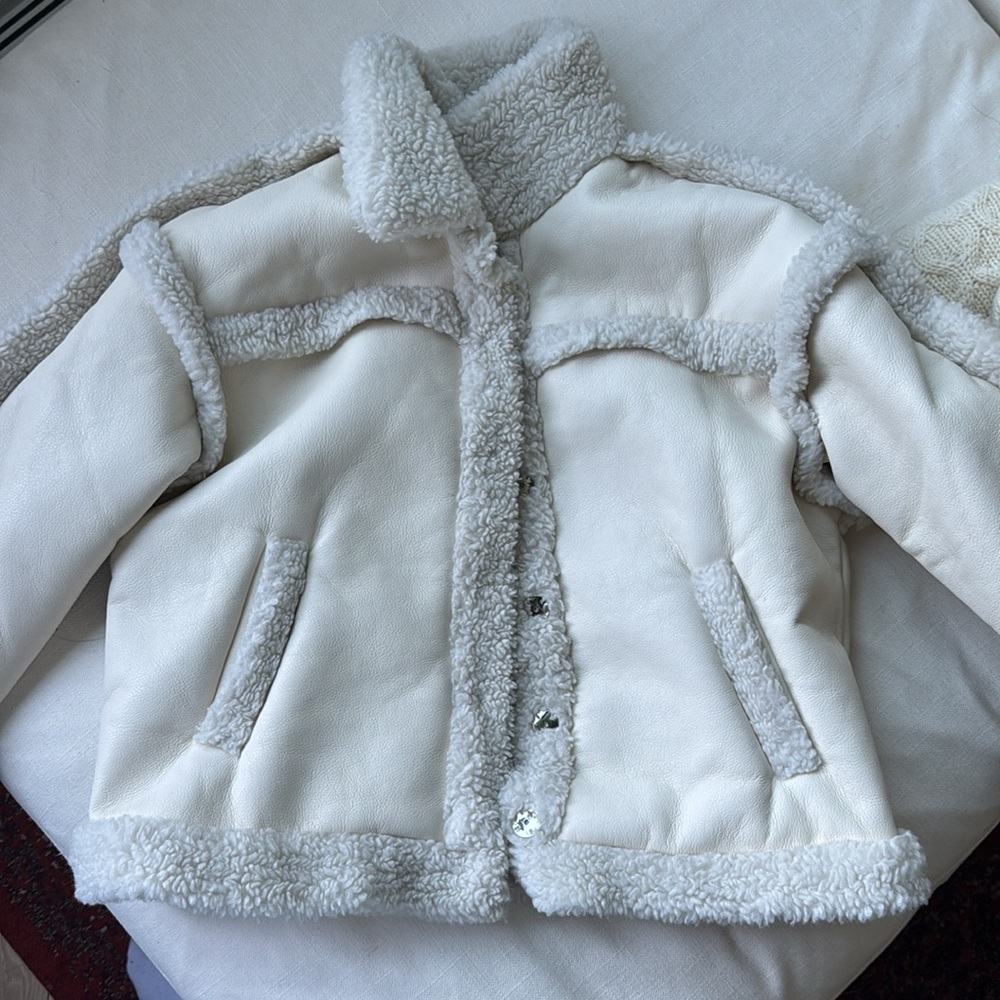 Cream and white faux leather coat